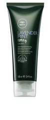 Tea Tree Lavender Mint Taming Cream bottle pour showcasing frizz control.