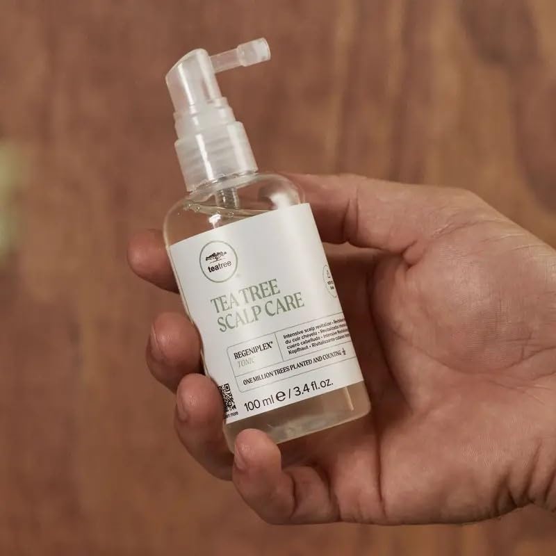 Tea Tree Regeniplex tonic spray-cap demonstrates easy spray application for scalp care.