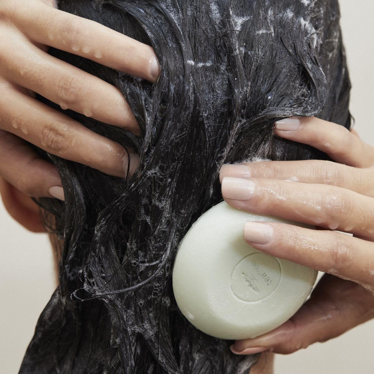 Tea Tree Special Shampoo Bar disc-format for compact cleansing.