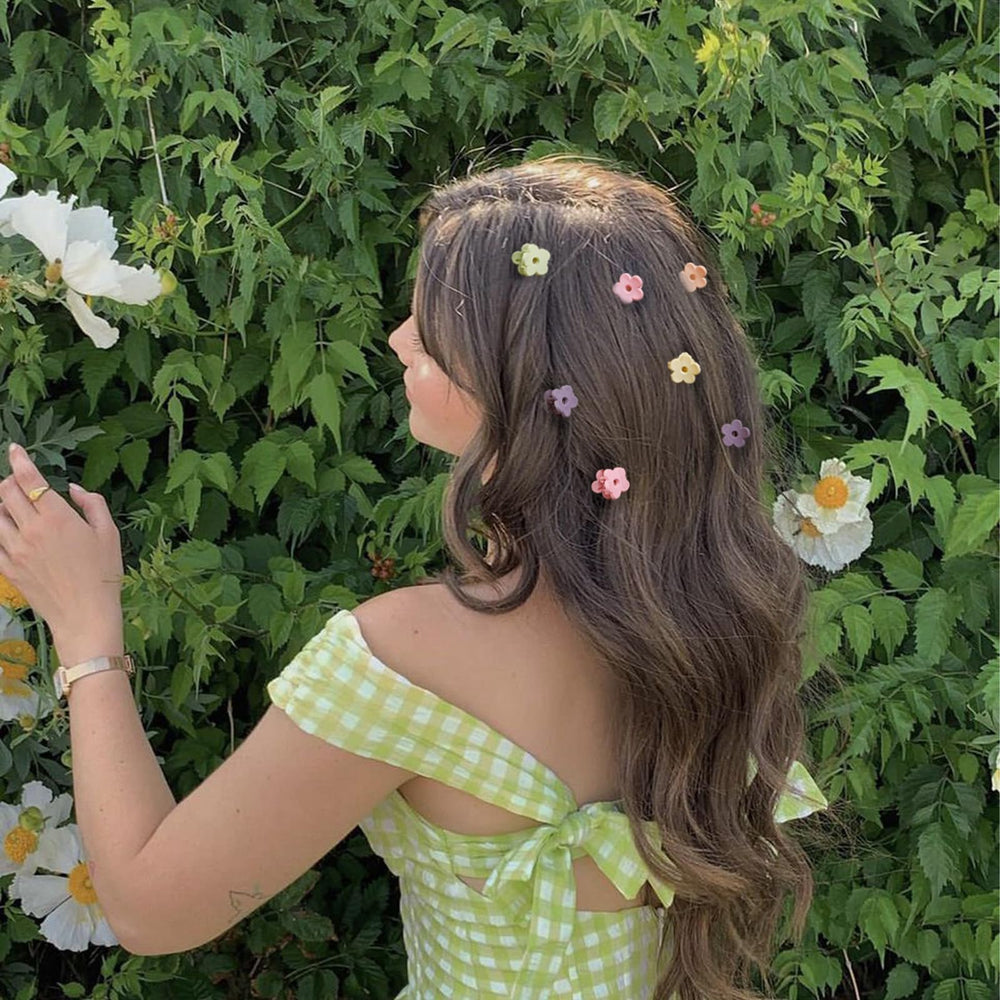 TEBIEKOY flower clips worn in hair add cute charm to daily looks.