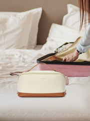 Telena leather makeup bag wide-opening design allows quick access to essentials.