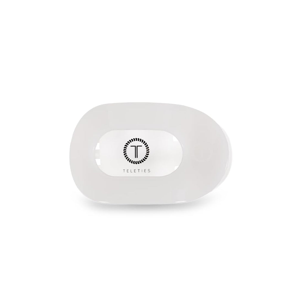 Teleties flat round clip in coconut white shows bendable teeth for a secure grip.