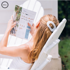 Teleties coconut white clip in use during driving shows steady hold.