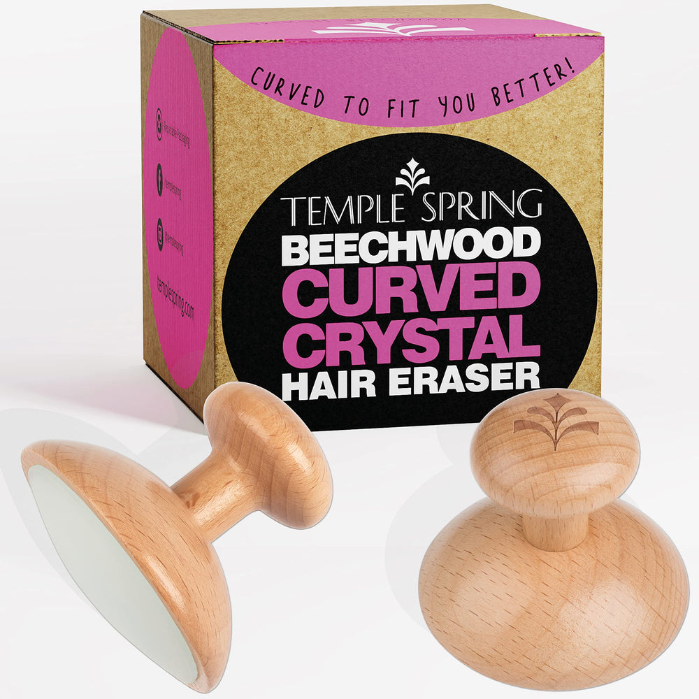 Temple Spring Curved Crystal Hair Remover Stone in palm grip for quick, painless removal.
