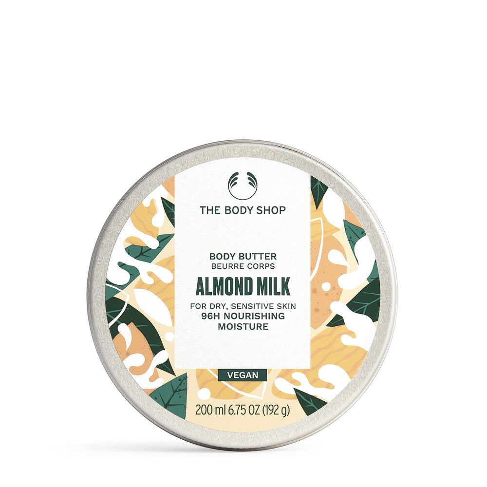 The Body Shop Almond Milk Body Butter jar closeup shows rich nourishing texture for dry skin