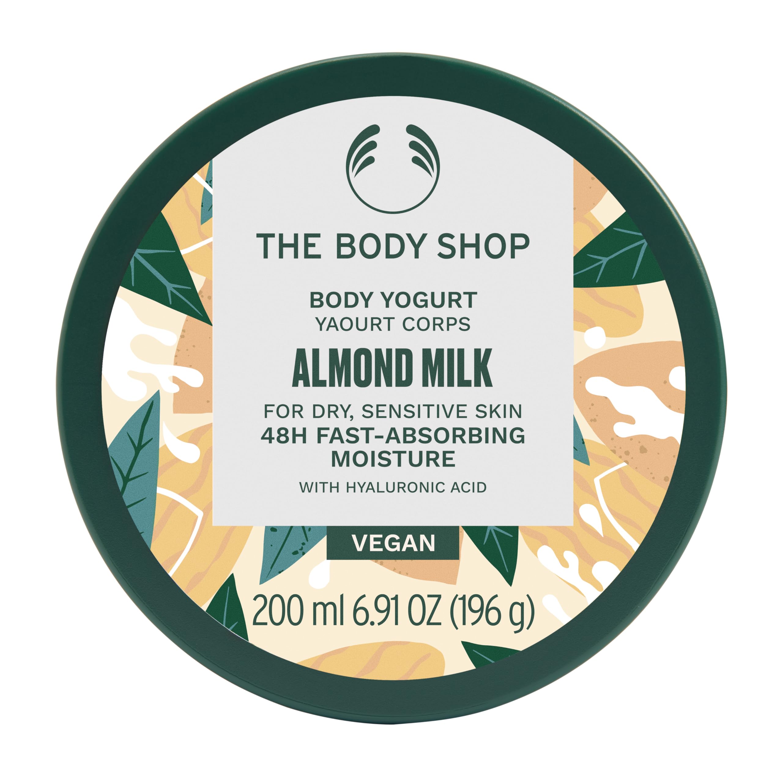 The Body Shop Almond Milk Body Yogurt jar close-up shows creamy gel-cream texture for fast absorption.