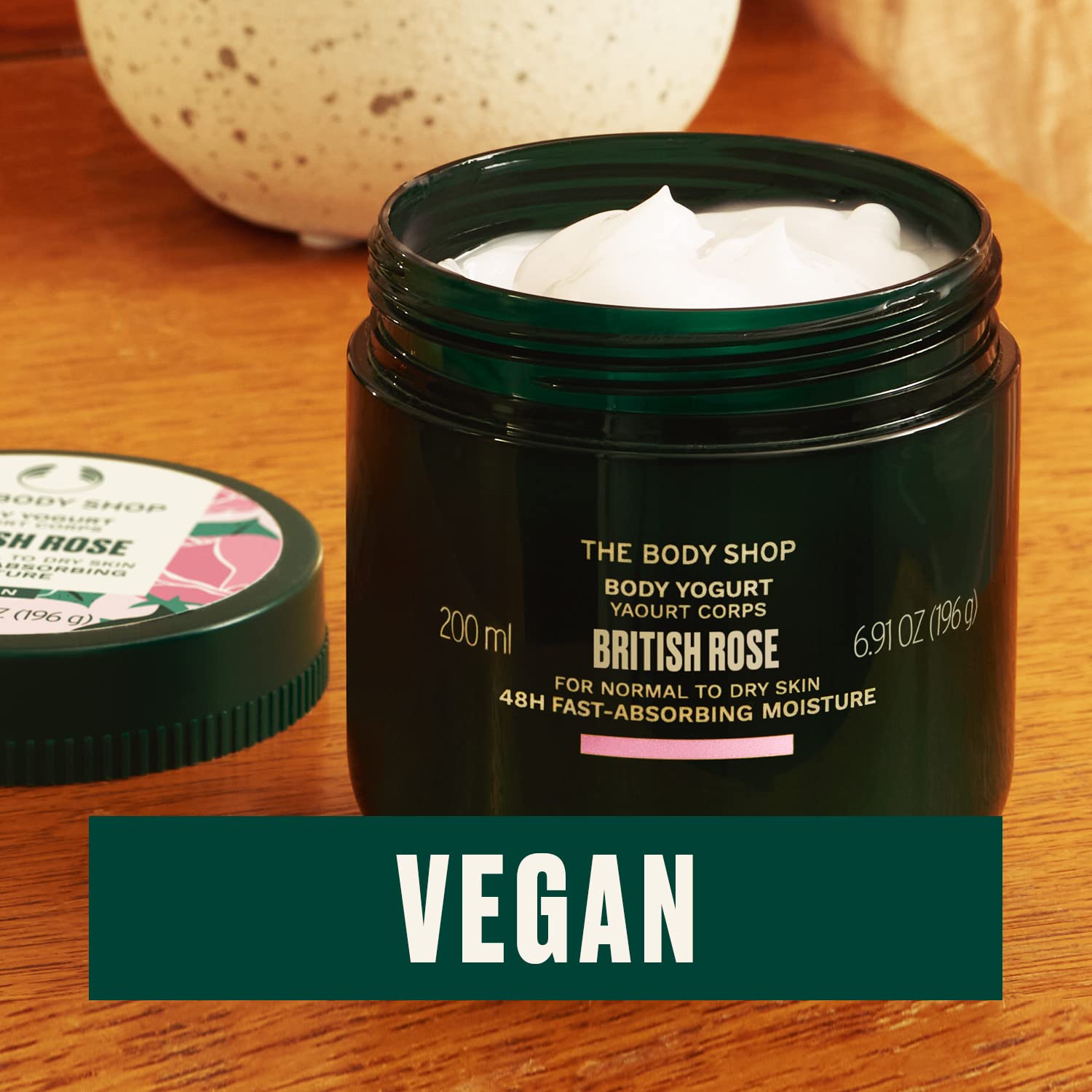 The Body Shop British Rose Body Yogurt rose-extract closeup evokes blooming scent and gentle skincare.