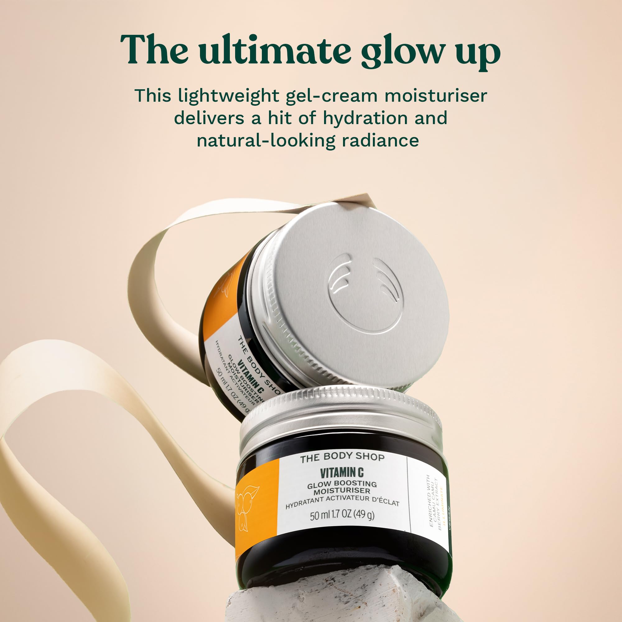 The Body Shop Glow Boost Moisturizer highlights camu camu ingredients for a hydrating boost.