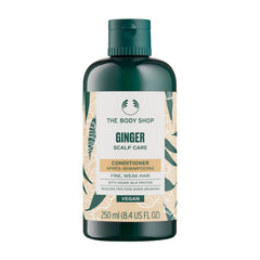 The Body Shop Ginger Scalp Care Conditioner bottle front with vegan formula for scalp soothing.