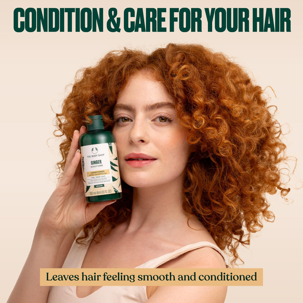 The Body Shop Ginger Scalp Care Conditioner texture closeup highlights creamy, non-greasy slip.