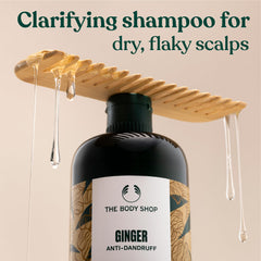 The Body Shop Ginger Scalp Care Shampoo rinsing action balances scalp and hair.