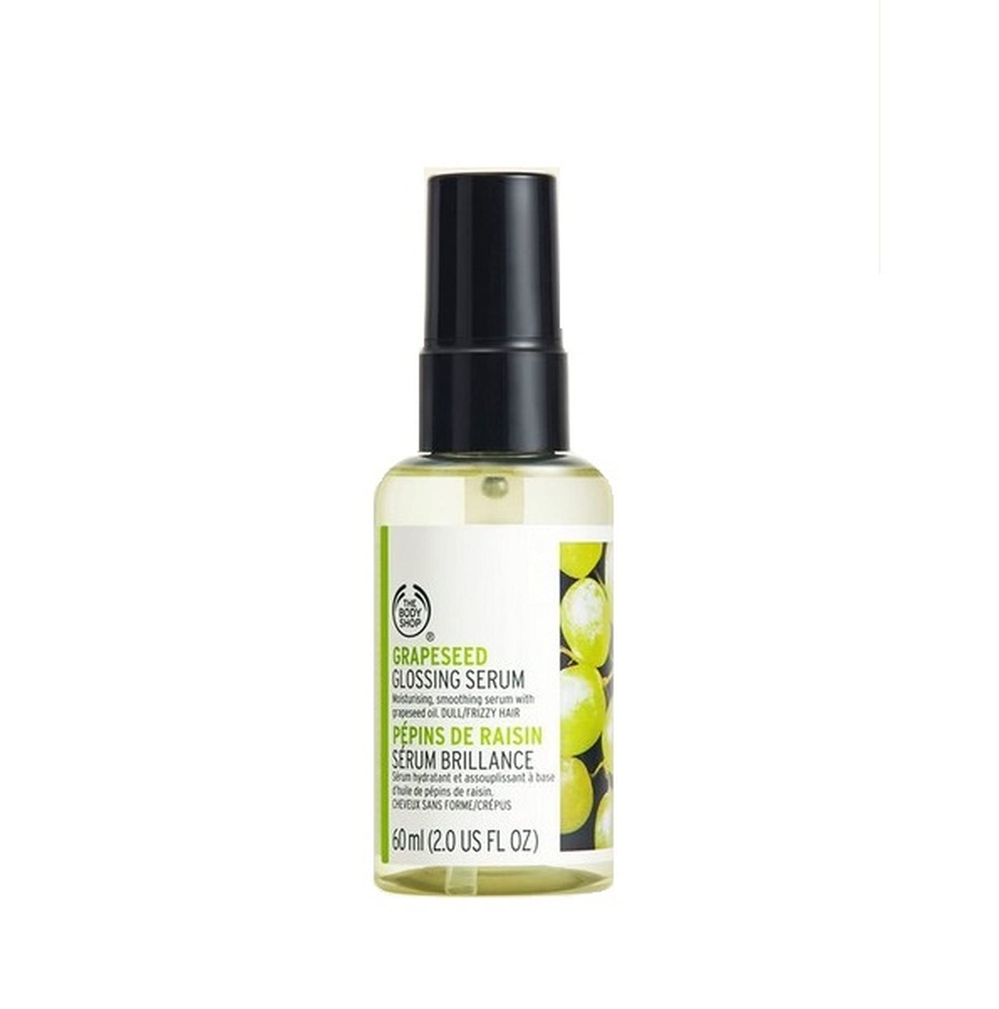 The Body Shop Grapeseed Glossing Serum bottle on a vanity for gloss and styling.