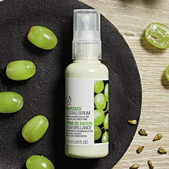 The Body Shop Grapeseed Glossing Serum on damp hair to enhance shine during styling.
