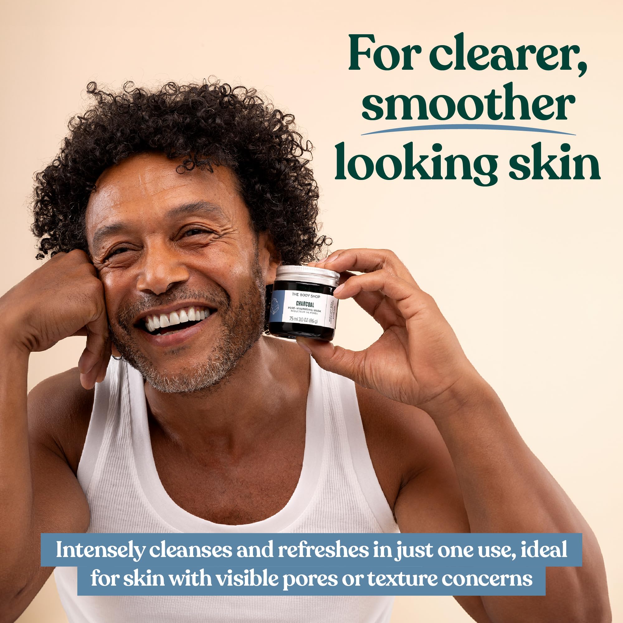 The Body Shop Himalayan Charcoal Purifying Glow Mask being applied for a refreshing cleanse
