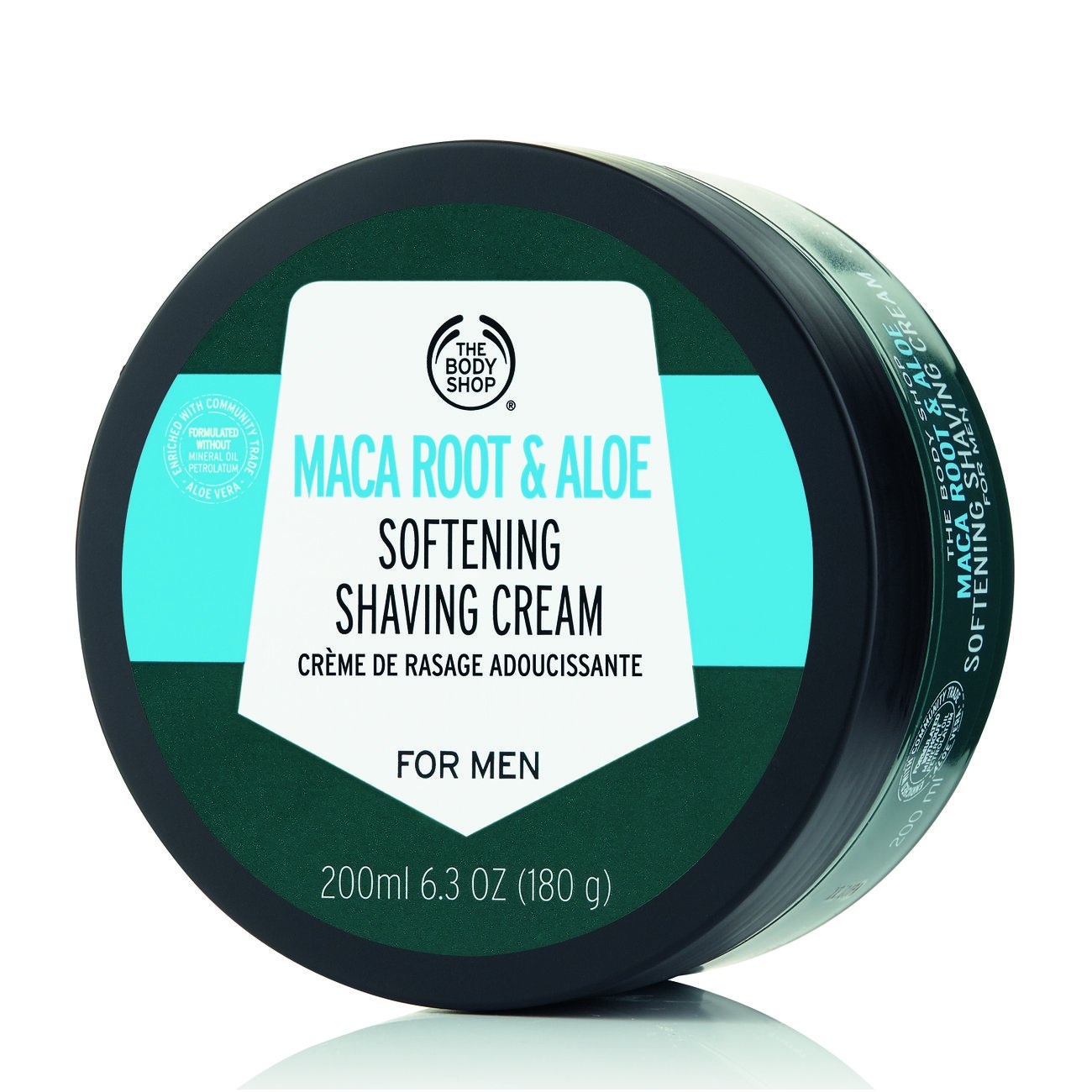 The Body Shop Maca Root & Aloe shaving cream tube closeup for luxuriously smooth shave prep.