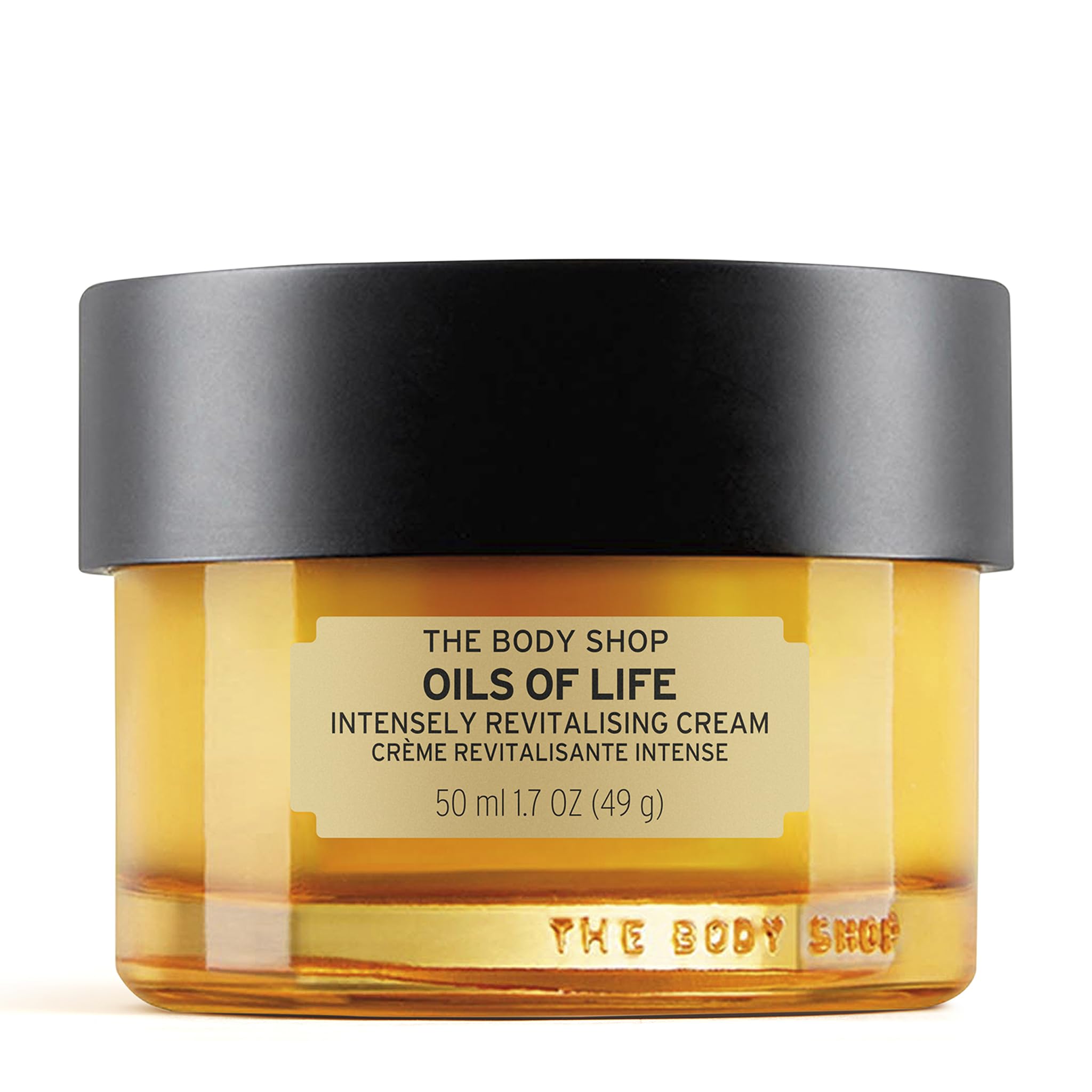 The Body Shop Oils of Life cream jar closeup shows nourishing texture for revitalized skin.