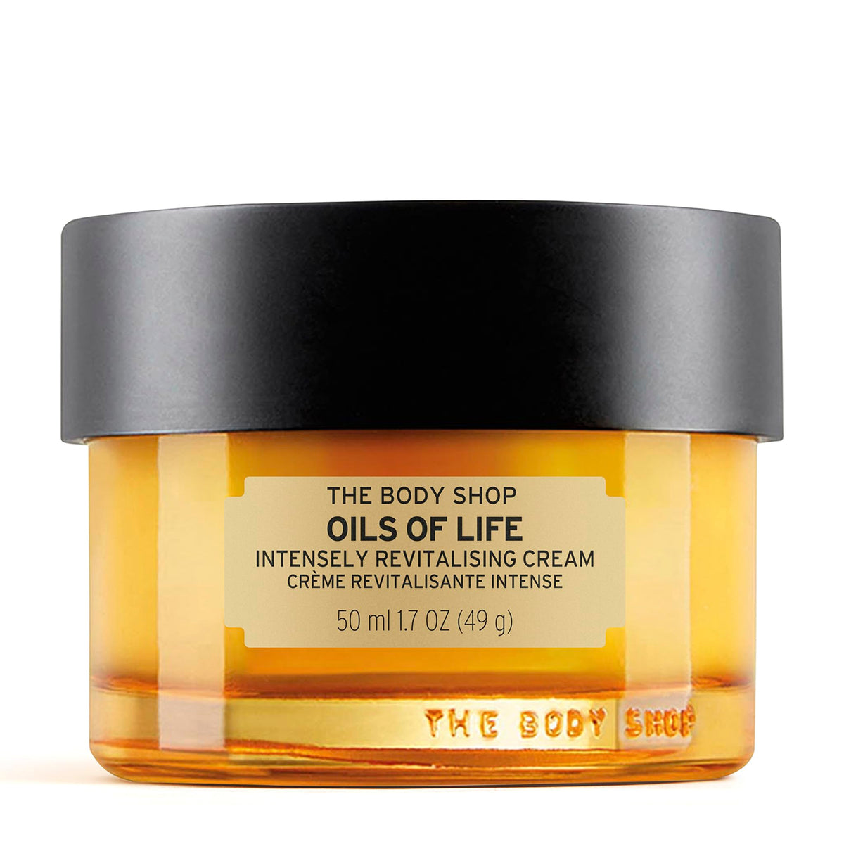 The Body Shop Oils of Life cream jar closeup shows nourishing texture for revitalized skin.