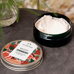 The Body Shop Strawberry Body Butter cream application demonstrating smooth, non-sticky absorption.