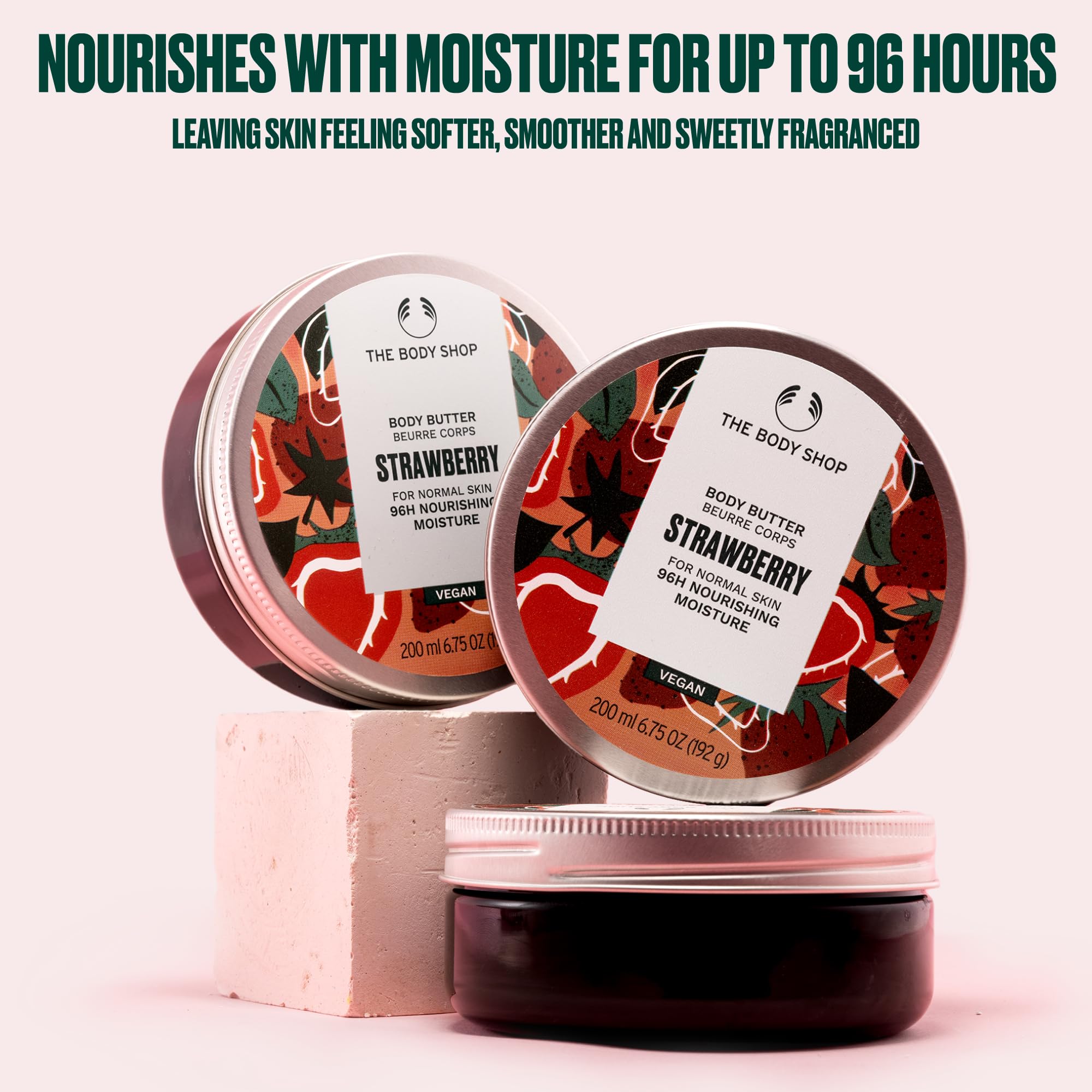 The Body Shop Strawberry Body Butter jar closeup highlighting creamy, non-greasy finish.