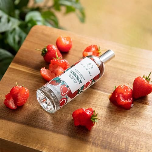 The Body Shop Strawberry Body Mist spray in action—quick, cooling, non-sticky application