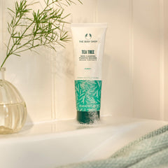 The Body Shop Tea Tree purifying cleanser face close-up highlighting clean, refreshed skin after washing.