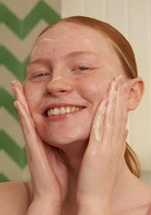 The Body Shop Tea Tree Skin Clearing Facial Wash packaging emphasizes vegan and fair-trade values.