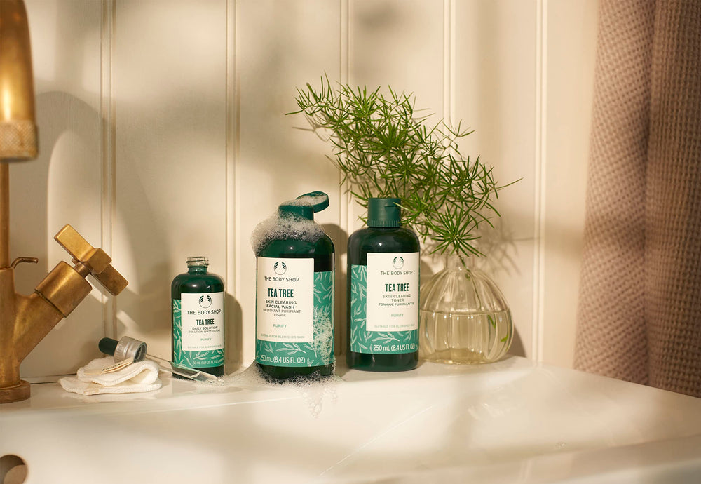 The Body Shop Tea Tree Toner packaging on shelf highlighting vegan and fair trade oil