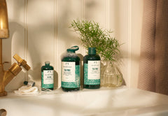 The Body Shop Tea Tree Toner packaging on shelf highlighting vegan and fair trade oil