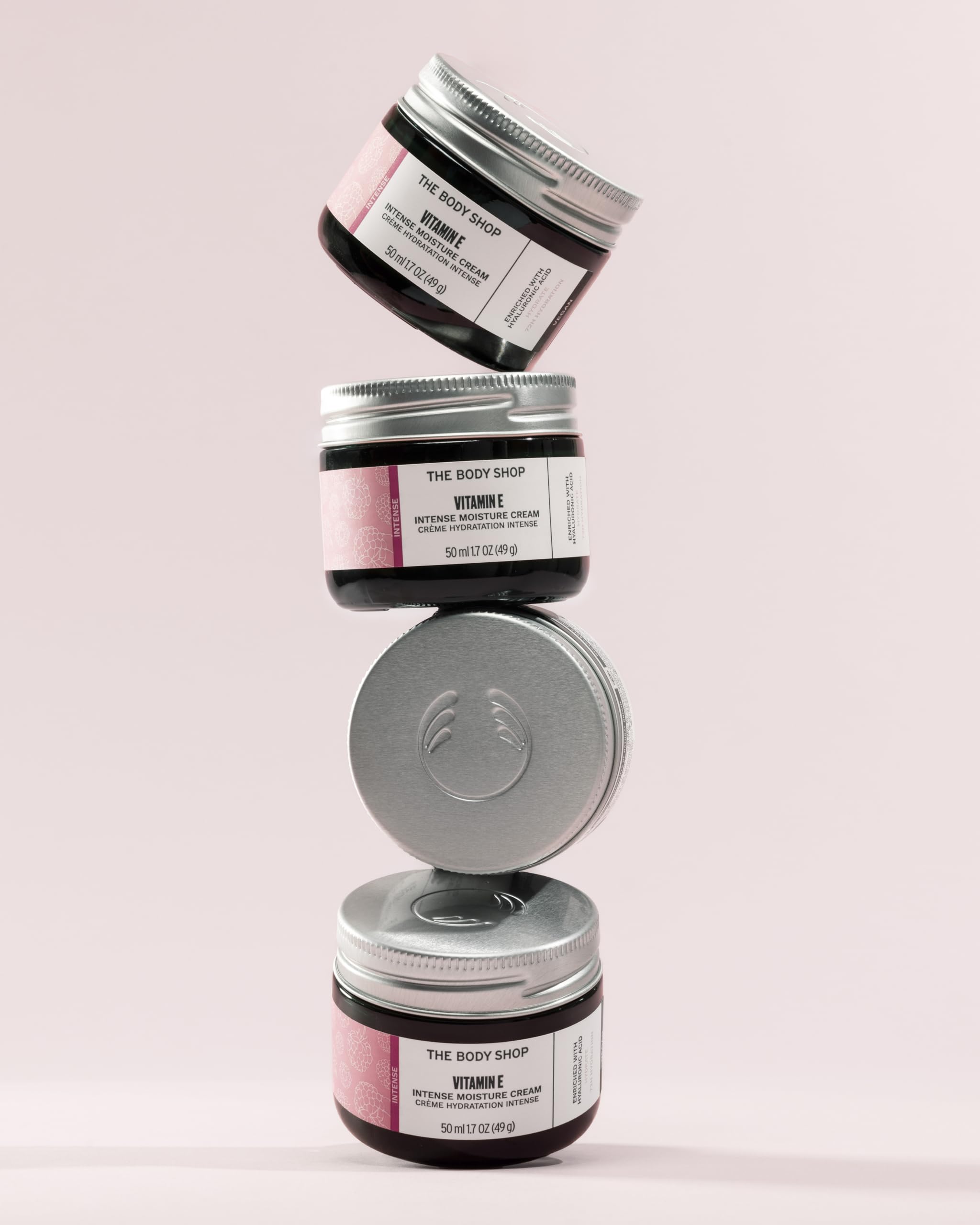 The Body Shop Vitamin E Intense Moisturizer on bathroom shelf suggests daily hydration routine