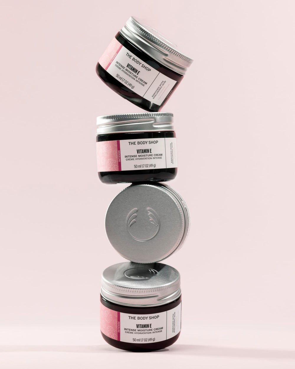 The Body Shop Vitamin E Intense Moisturizer on bathroom shelf suggests daily hydration routine