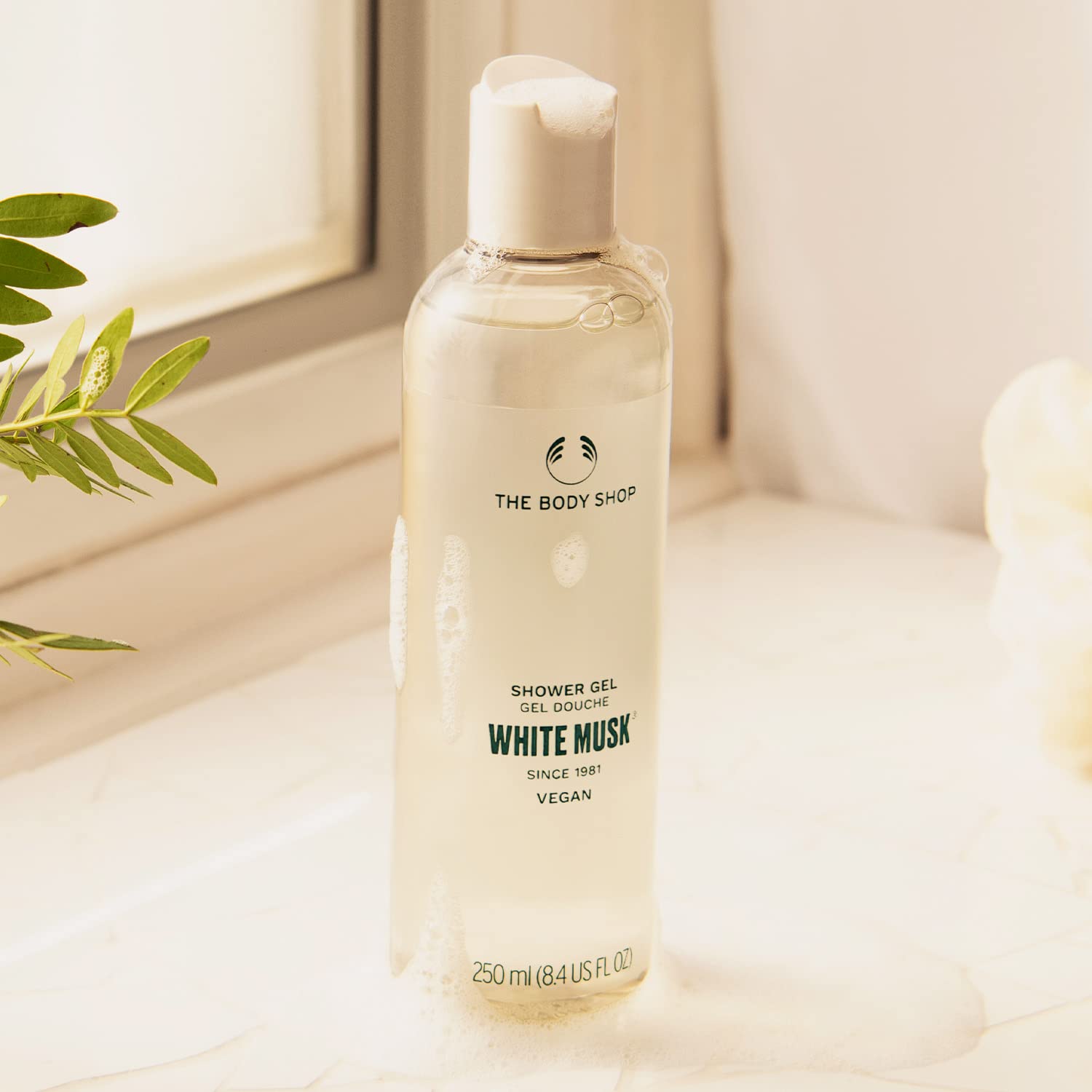 The Body Shop White Musk Shower Gel fragrance notes graphic highlights jasmine, lily, and vanilla.