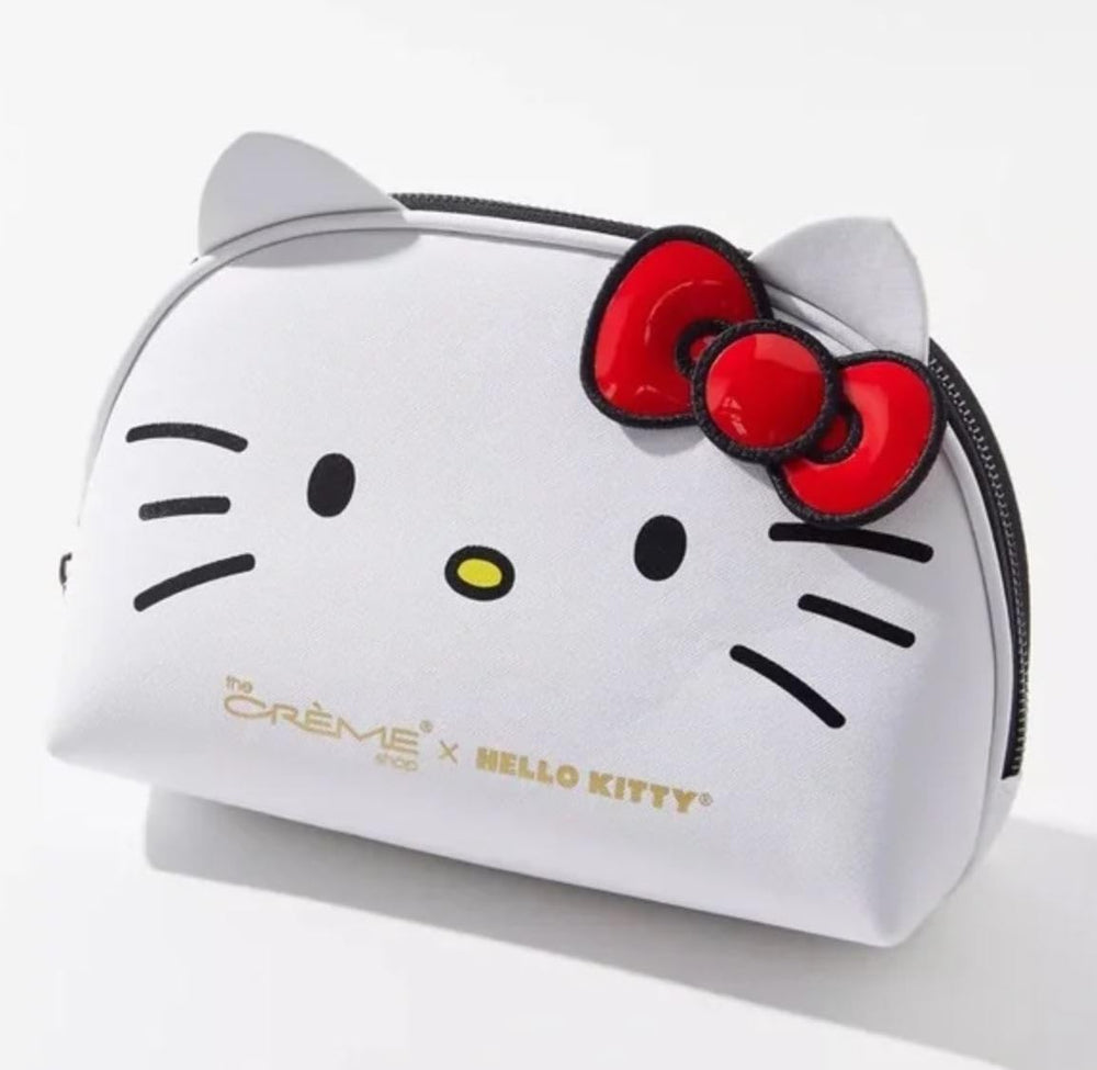 The Crème Shop Hello Kitty dome pouch, open view showing organized makeup space.