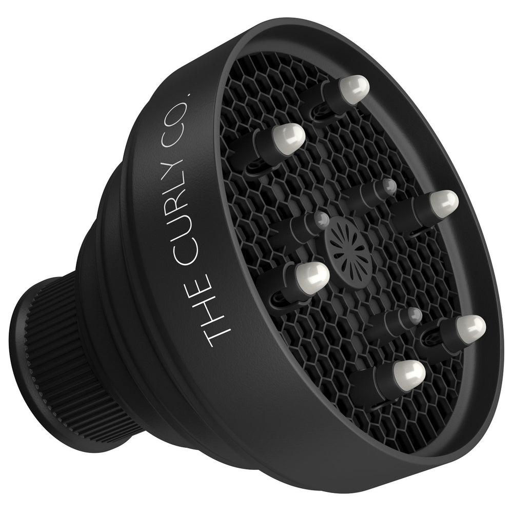 The Curly Co collapsible hair diffuser folded for ultra-portable storage after travel.