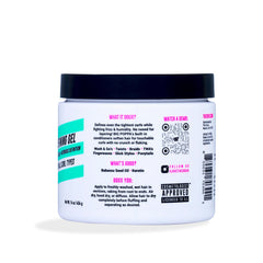 The Doux Big Poppa bottle with curls shows defined coils and soft shine on model.