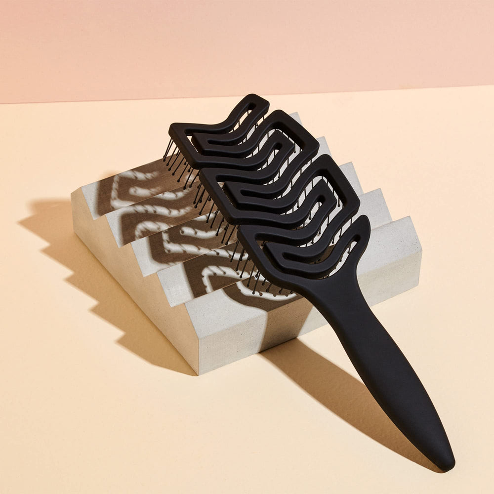 The Hair Edit ergonomic paddle design supports comfortable styling and better control.