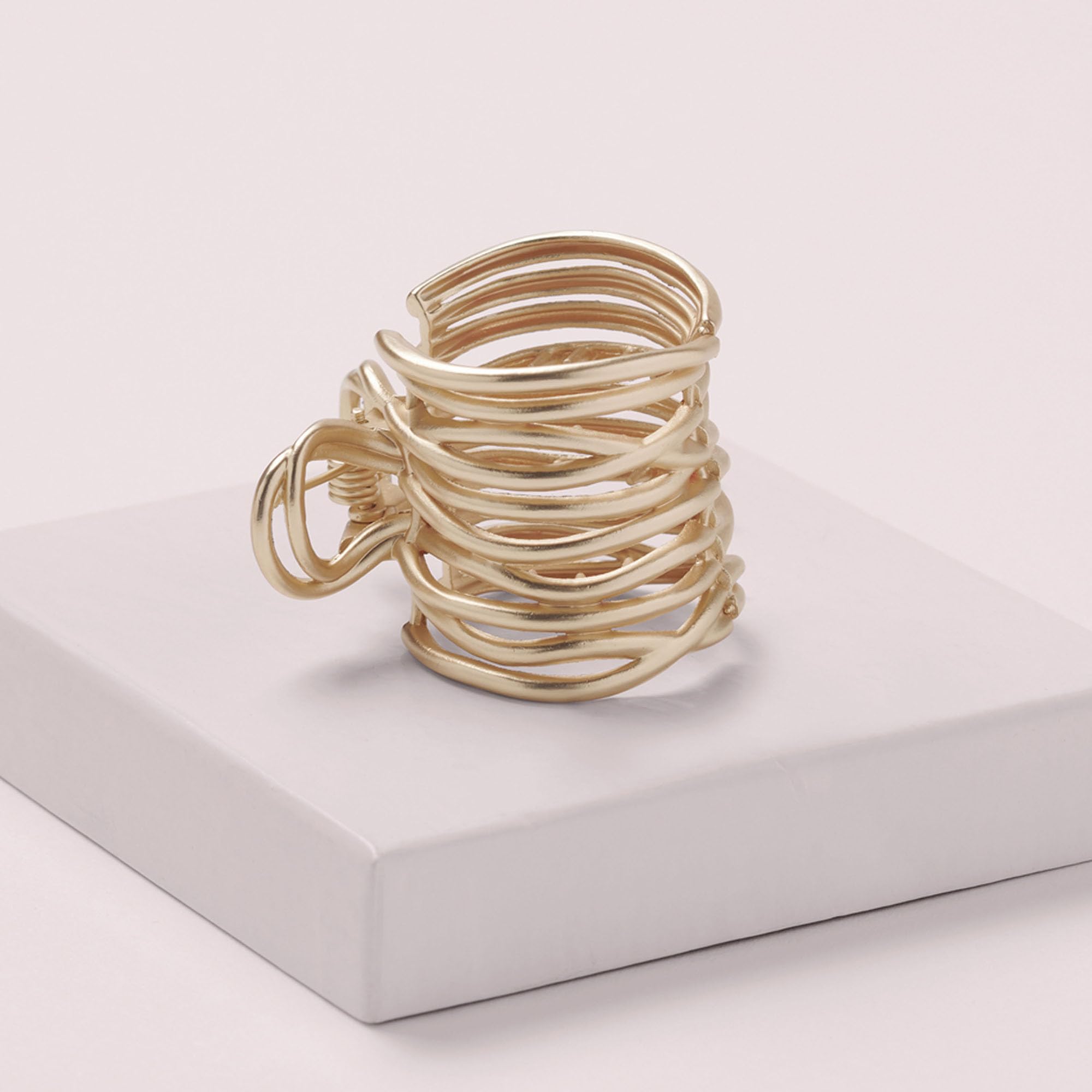 The Hair Edit gilded wrap ponytail cuff clip on ponytail demonstrates versatile styling for day-to-night looks.