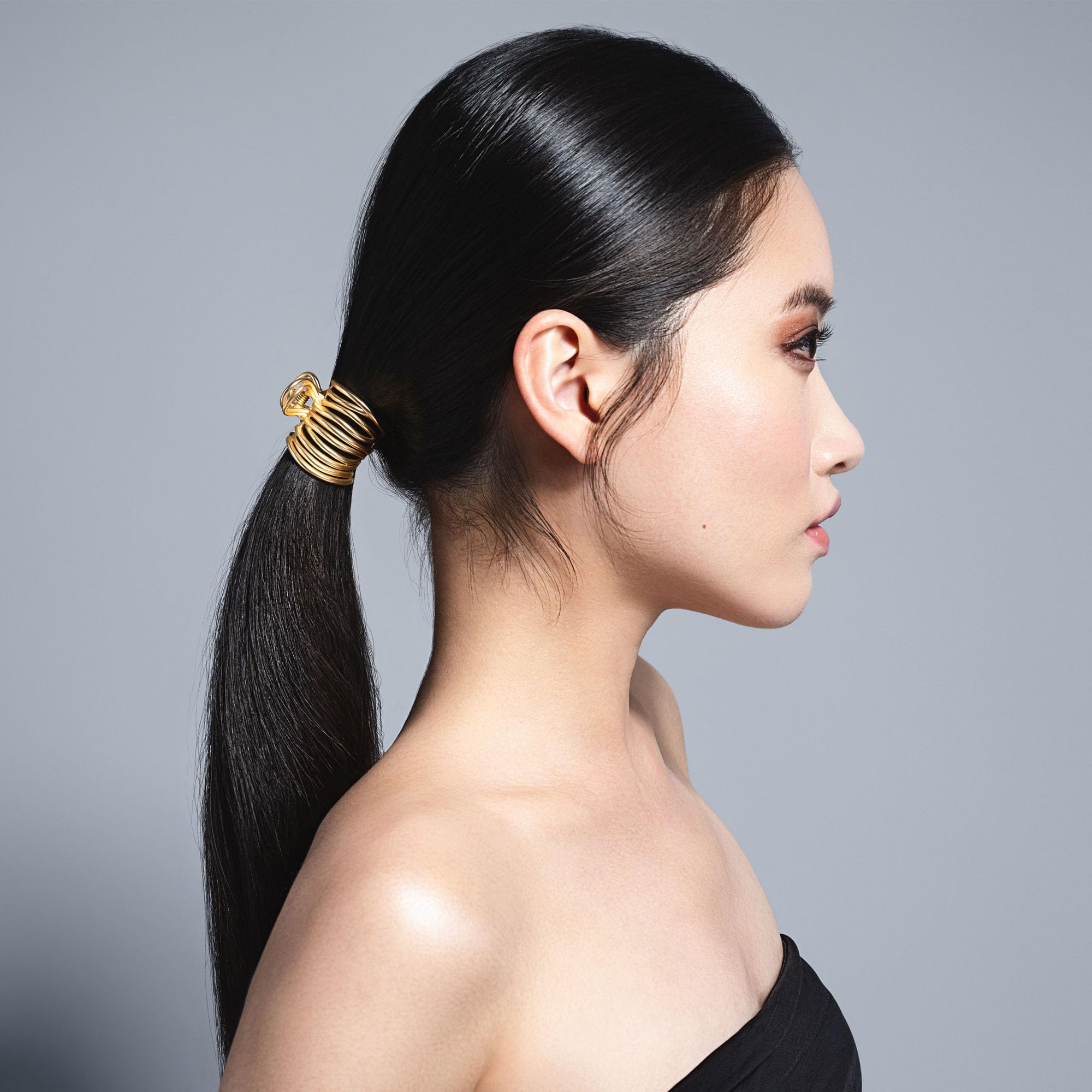 The Hair Edit gilded wrap ponytail cuff clip wrapped hair shows secure hold with a polished finish.