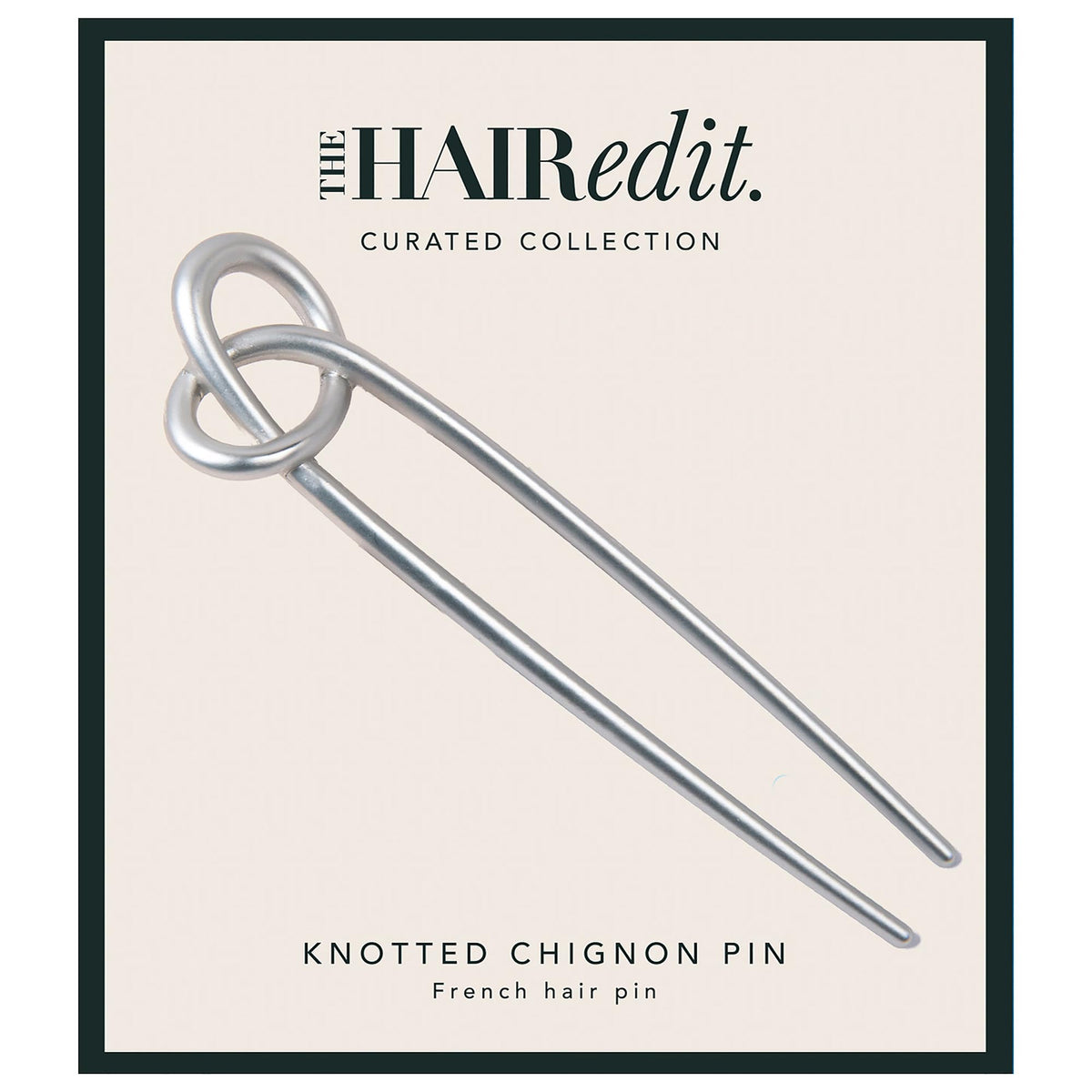 The Hair Edit knotted chignon pin hero showing matte silver finish for an elegant, secure updo