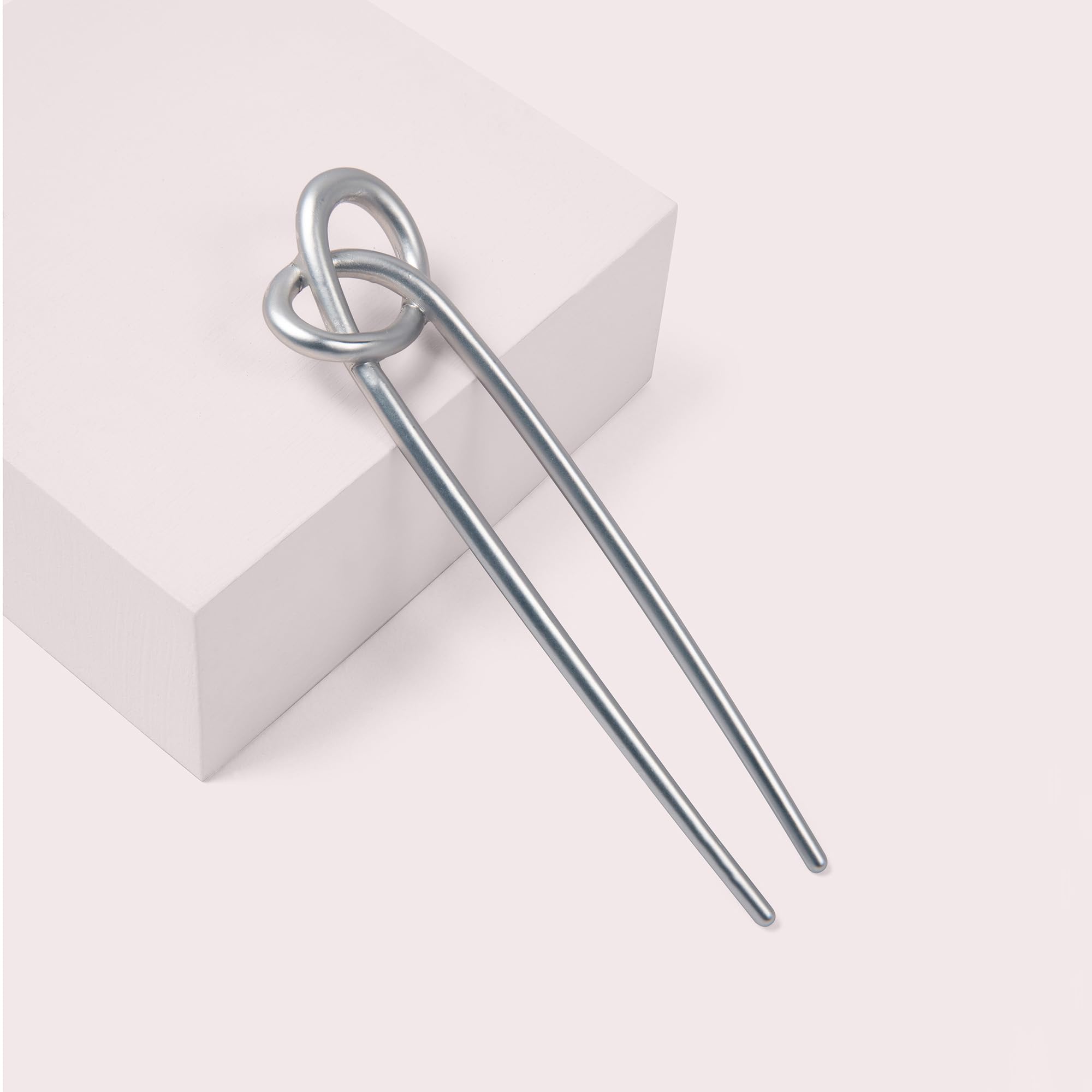 The Hair Edit knotted chignon pin in use demonstrates chic minimal design for versatile styling