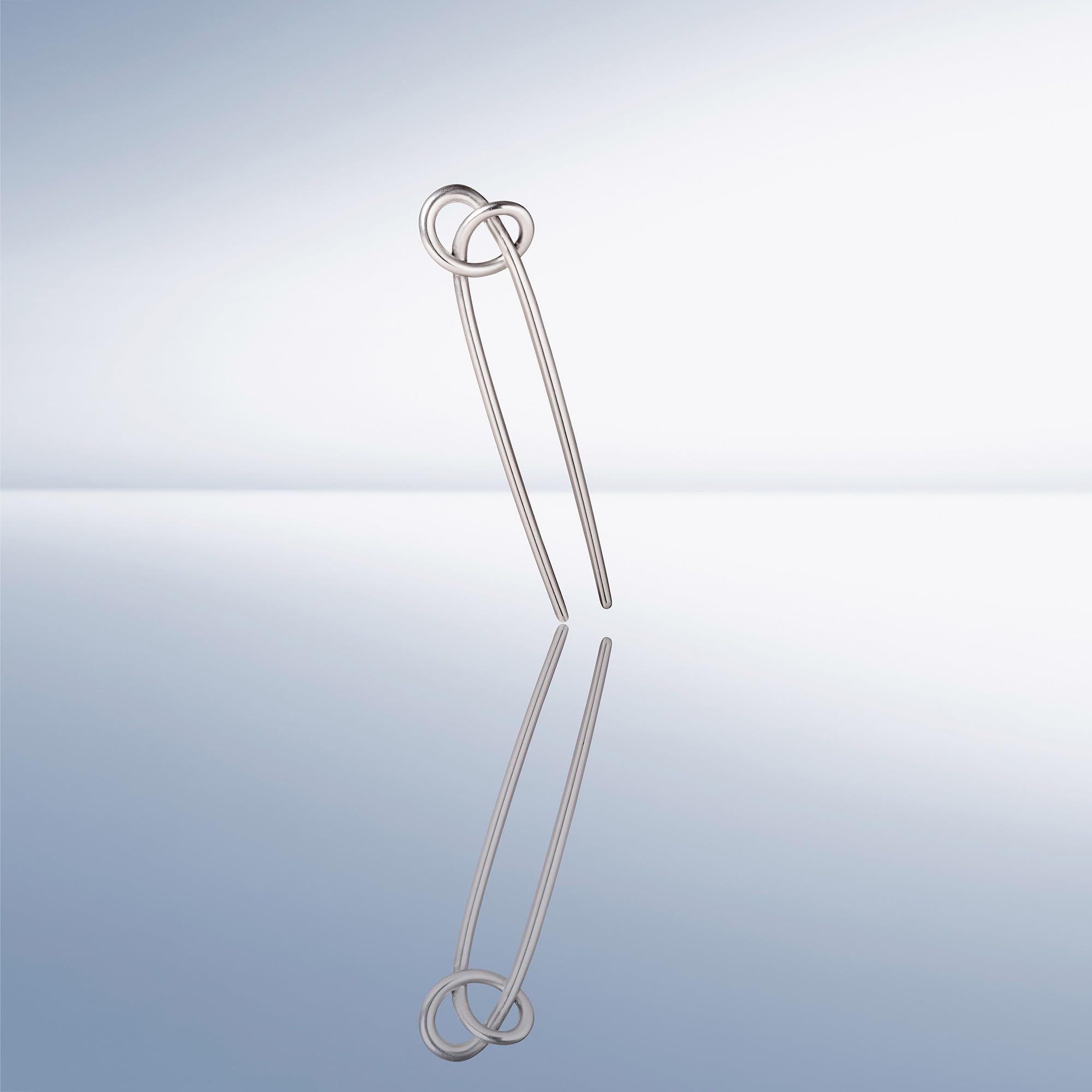 The Hair Edit knotted chignon pin packaging highlights accessory that complements professional and casual looks