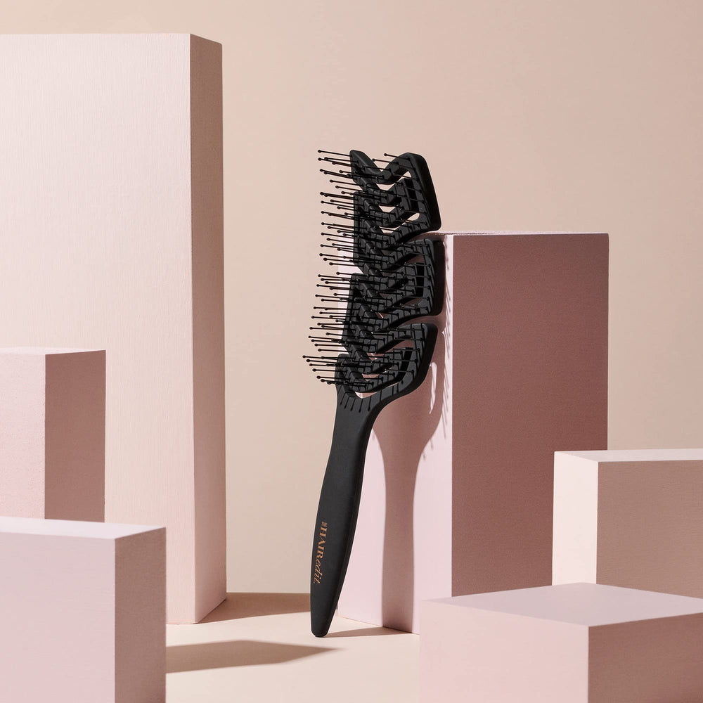 The Hair Edit non-slip grip handle keeps brushes secure in wet showers.