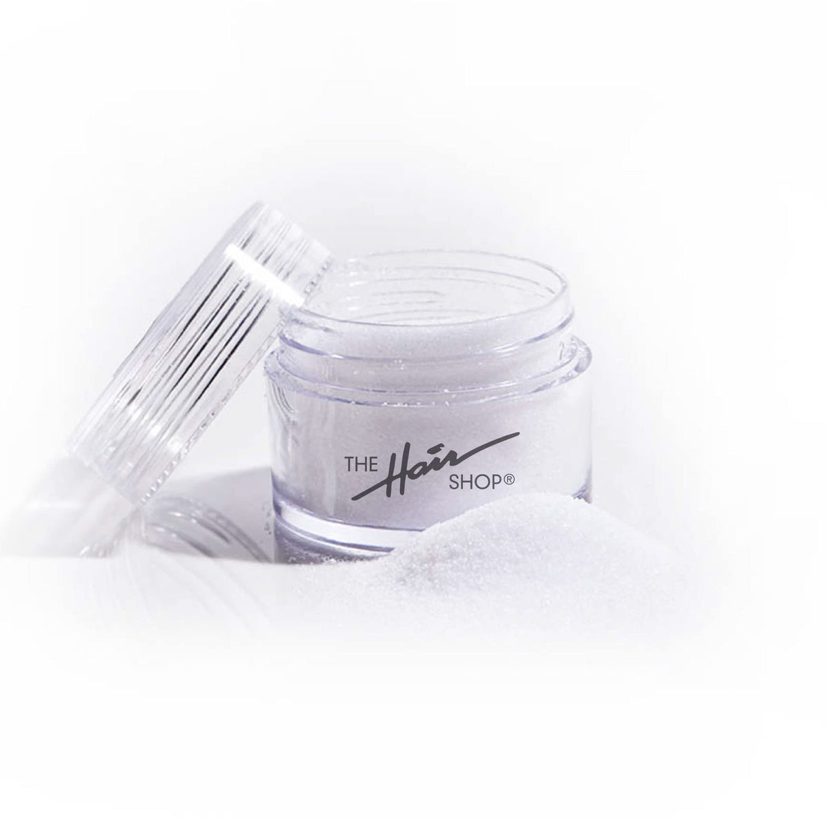 The Hair Shop keratin glue powder jar shows reuse-ready bonding for extensions.
