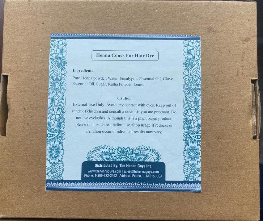 The Henna Guys natural ingredients label closeup highlights pure plant-based care for hair.