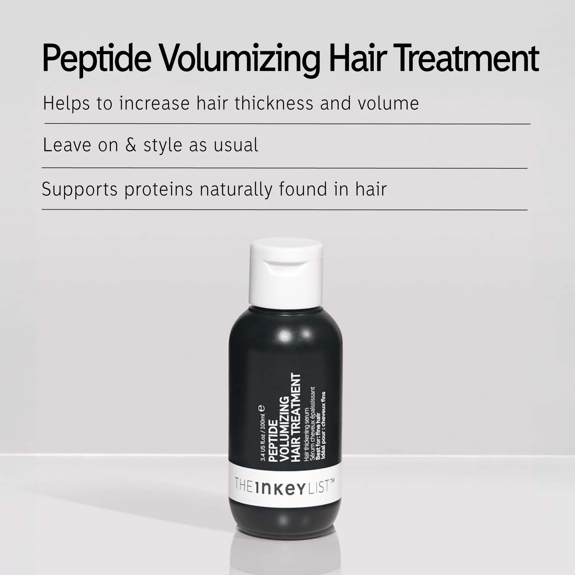 The INKEY List Peptide Volumizing Hair Treatment being massaged into hair for even distribution.