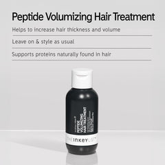 The INKEY List Peptide Volumizing Hair Treatment being massaged into hair for even distribution.