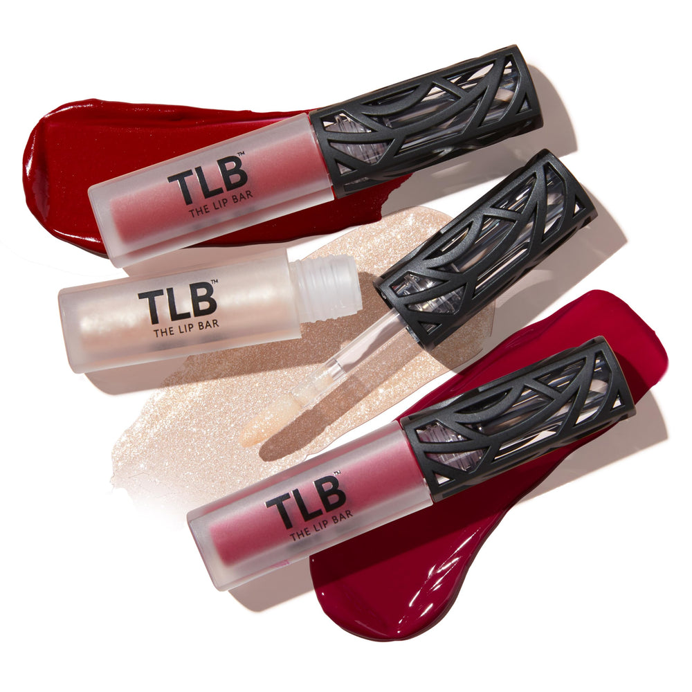 The Lip Bar Trophy Wife Gloss Up swatch reveals shimmering clear finish.
