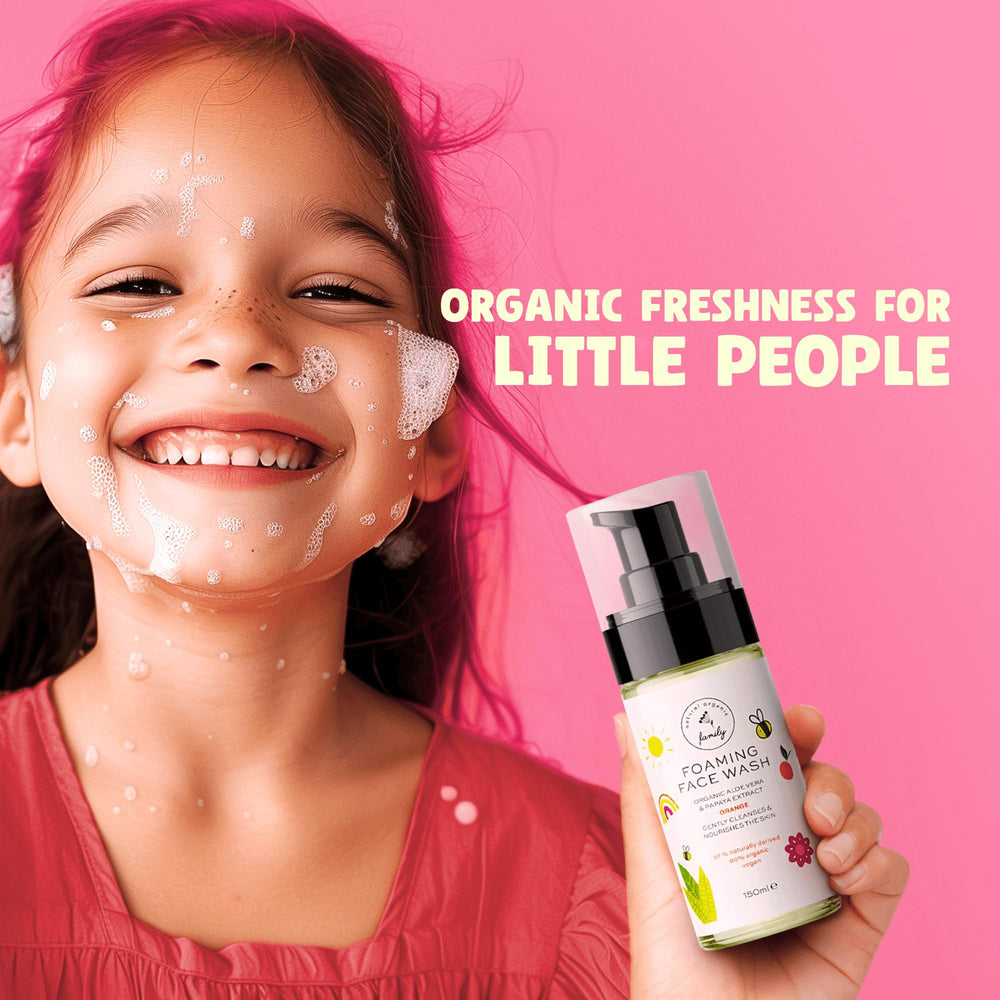 The Natural and Organic Family Kids Foaming Face Wash foam on child's face demonstrates gentle cleansing.