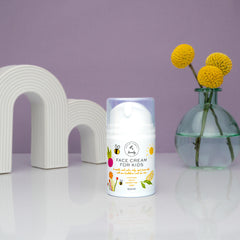 The Natural and Organic Family strawberry and cranberry extracts visual suggesting soothing botanicals for delicate skin
