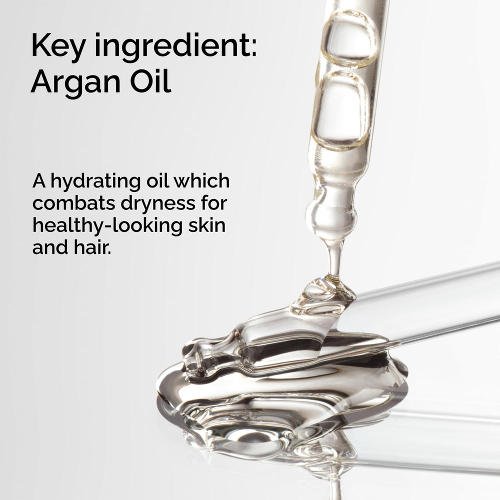 The Ordinary argan oil dropper dispensing a golden drop for precise application benefits