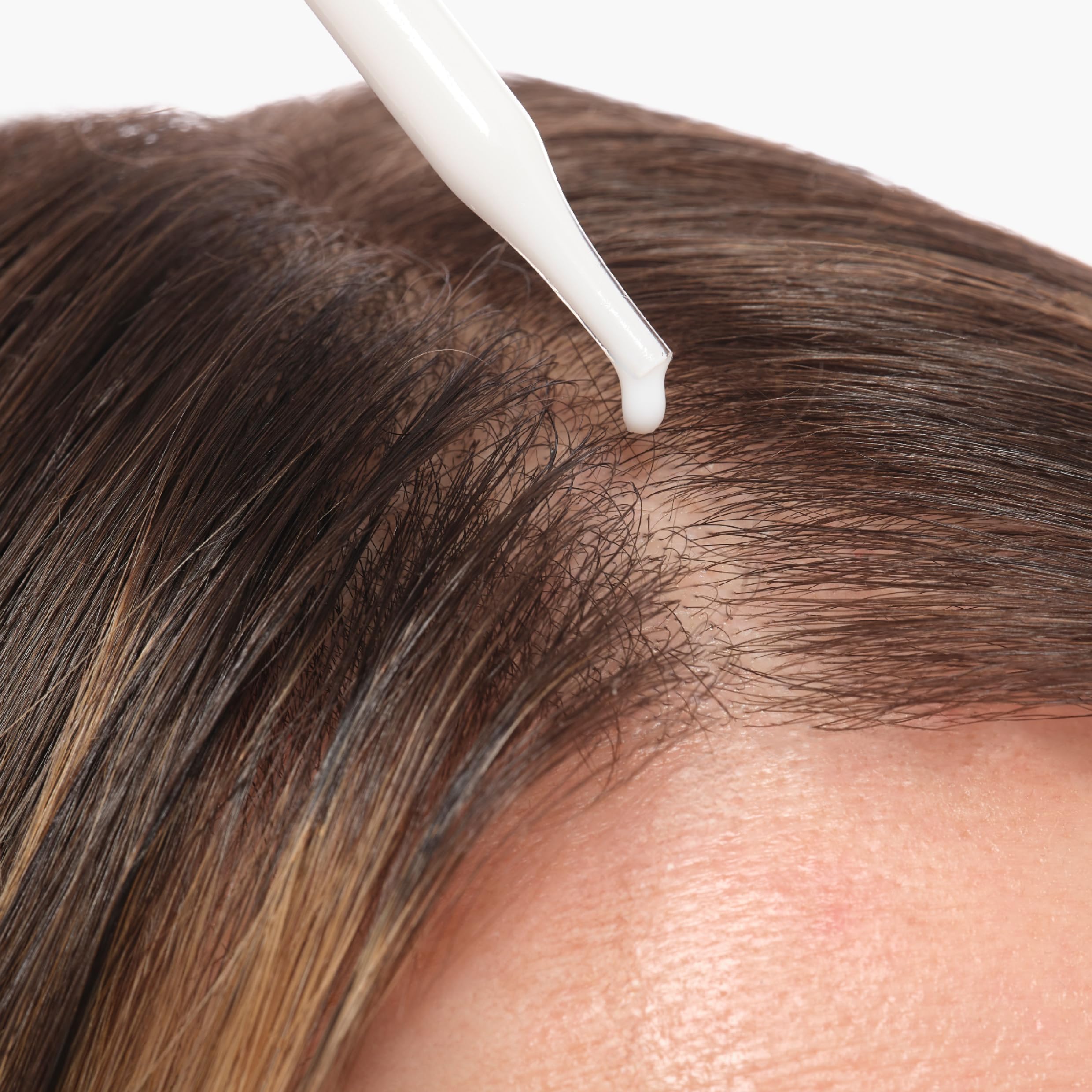 The Ordinary bottle with dropper in hand for precise targeted application